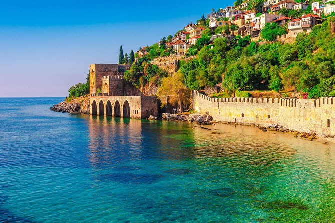 Alanya Catamaran Boat Tour with Sunbathing Swimming & Snorkelling - Sights From the Water: Red Tower, Old Shipyard, and Alanya Castle