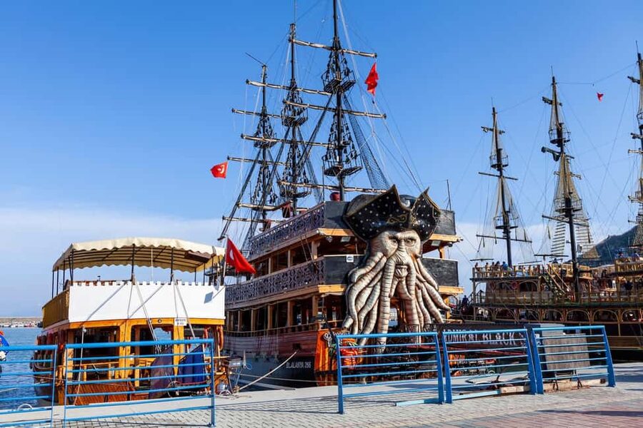 Alanya: Pirate Boat with Transfer, Lunch & Unlimited Drinks - Alanya Landmarks From the Deck: Red Tower, Castle, and Old Shipyard