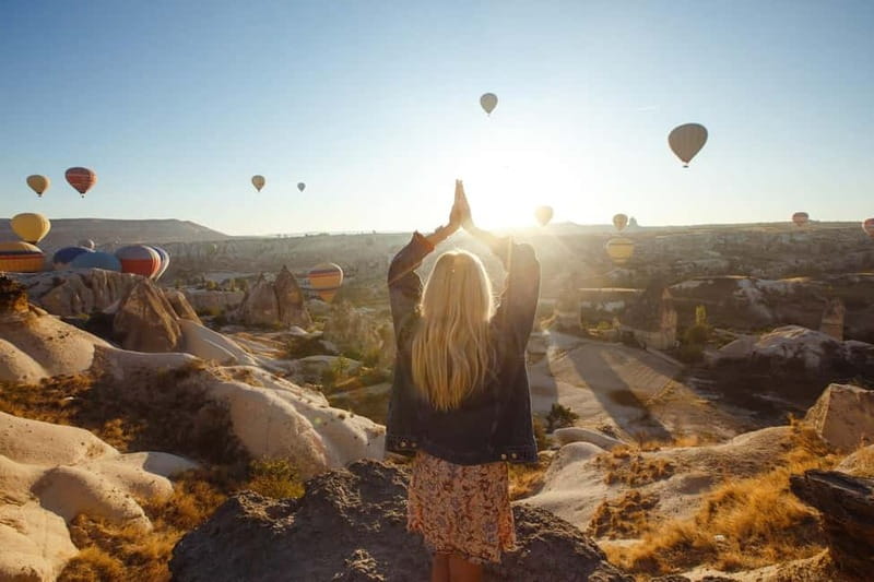 Cappadocia: Sunrise Fairy Chimneys Hot Air Balloon Watching - Before takeoff: fairy chimneys, balloon prep, and coffee to stay human