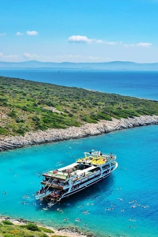 Cesme: Islands and Bays Boat Trip with BBQ Lunch - Boarding the Poseidon: 4 decks, reserved loungers, and comfort basics