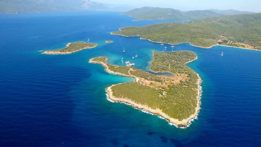 Marmaris: Cleopatra Island Boat Trip with Lunch and Transfer - Deep Blue Bay: The Dark-Water Photo Moment