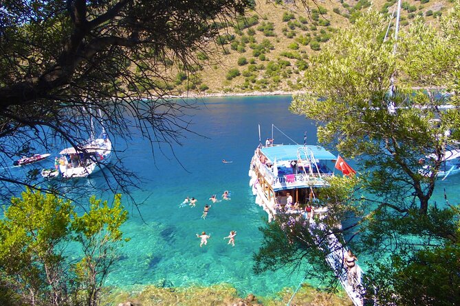 Ölüdeniz: Butterfly Valley Boat Trip with Buffet Lunch - Butterfly Valley: cliffs, sheltered swimming, and the butterfly season reality