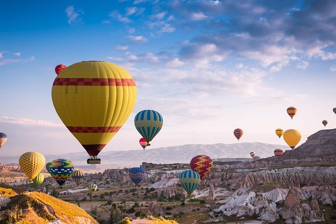 Sunrise Hot Air Balloon Flight Over Göreme & Fairy Chimneys - Landing toast, certificate, and the photo upsell reality